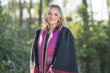 Aubrie in graduation cap and gown
